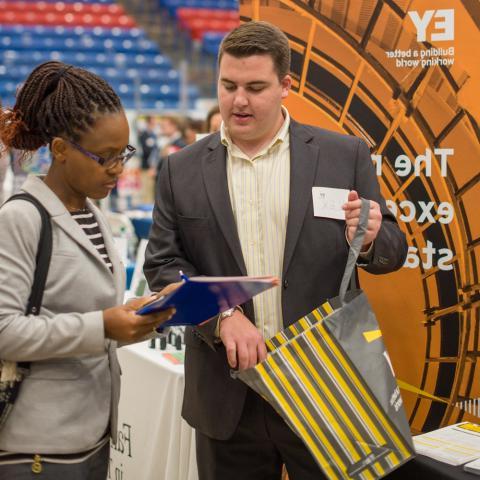 UNH Student with employer at UNH Career Fair