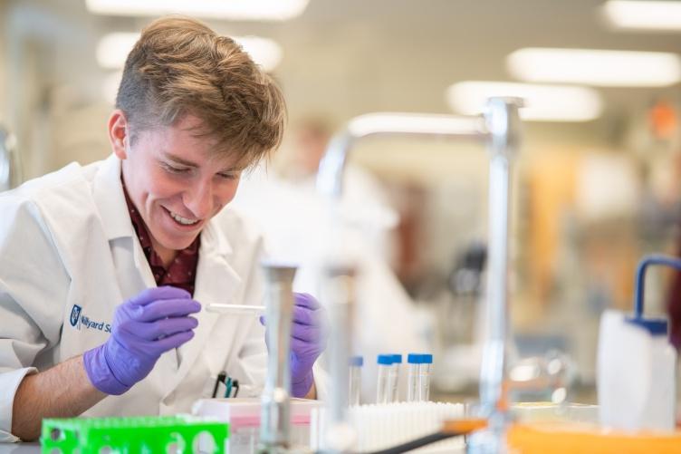 Thomas Gerton '23, biotechnology major, works in the lab at UNH Manchester